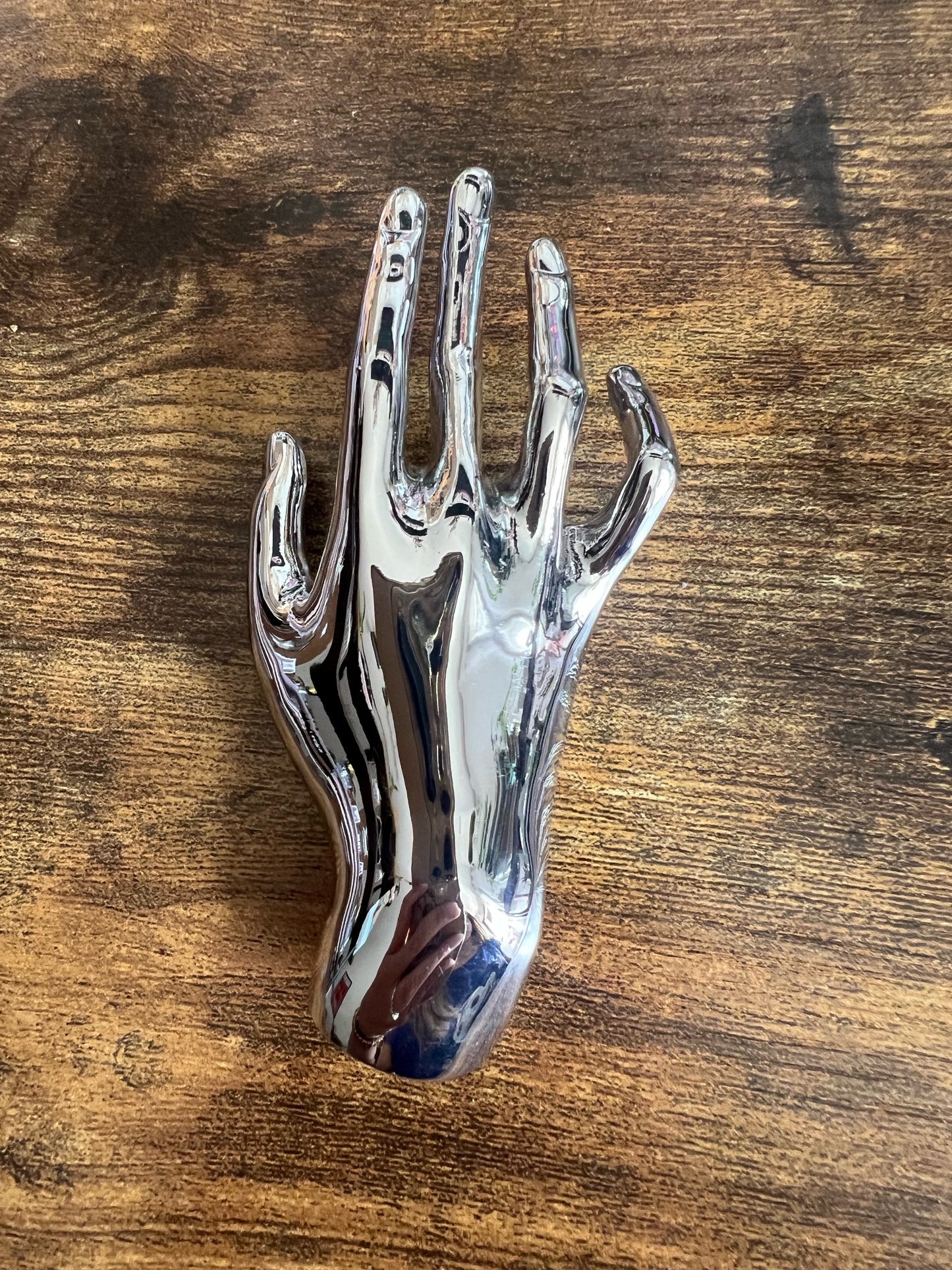 Broche mano plateado